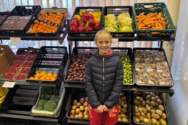 Lily visiting S2 Food Bank's Community Food Shop across the road from St Swithun's
