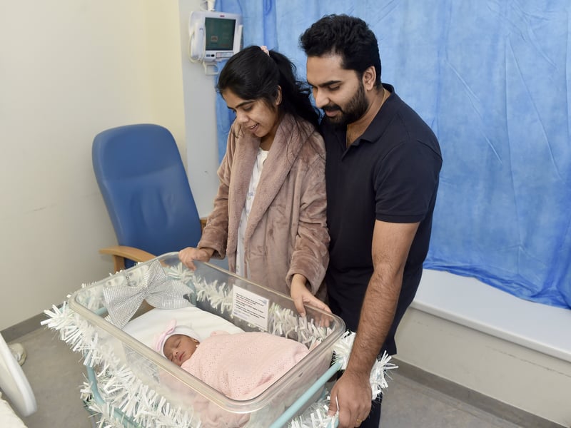 Kripa Baby, 28,and her husband Basil Kurian, 29, from Waterlooville, with their daughter Elora Basil, who was the first baby to be born at QA Hospital on Christmas Day at 5.17am. Picture: Sarah Standing (261224-8071)