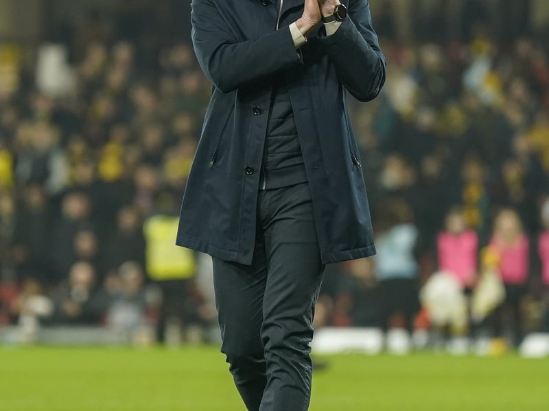 Pompey boss John Mousinho salutes the away fans.