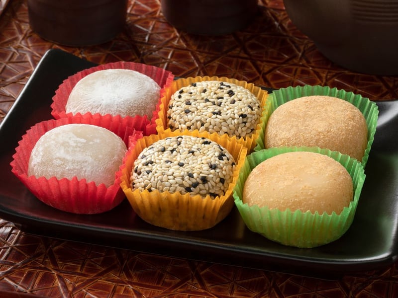 Staying in Japan, families also partake in 'osechi ryori', a special meal comprising beautifully arranged dishes, each symbolising wishes for health, prosperity, and happiness. Mochi-making (pictured) and sending New Year’s postcards, or "nengajo," further enrich the festivities.