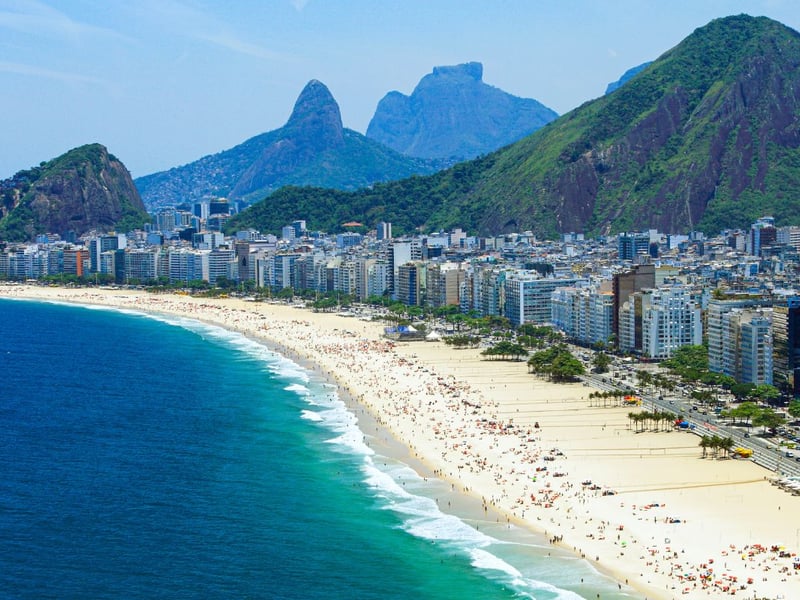 On Brazil’s iconic Copacabana Beach, locals and visitors alike wear white and offer flowers and candles to Iemanjá, the sea goddess. These offerings are sent out to sea in small boats as a gesture of gratitude and a wish for prosperity in the coming year. White attire symbolises peace, while fireworks illuminate the skies above the beach in a dazzling display. Festivities often include samba music and dancing, creating a vibrant and joyous atmosphere that lasts until dawn.