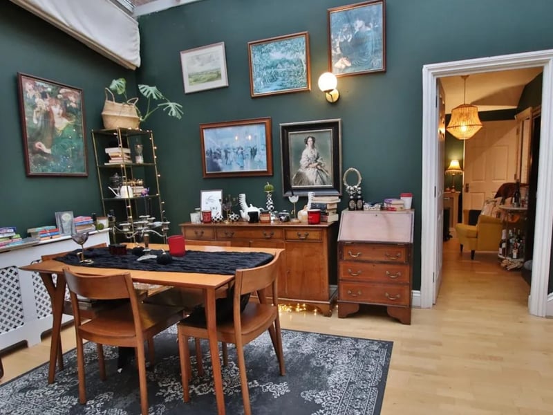 The listing says: "Located in the prestigious grounds of Hound Manor, this immaculately presented apartment boasts a charming dining/reception hallway with a stunning vaulted glass ceiling as its focal point."