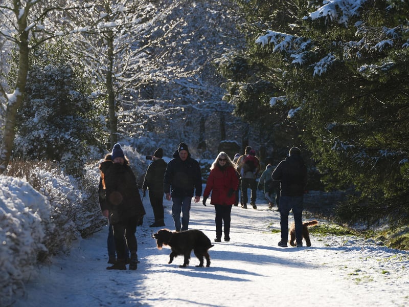 People take a walk through the snow in the Pentland Hills, Balerno.