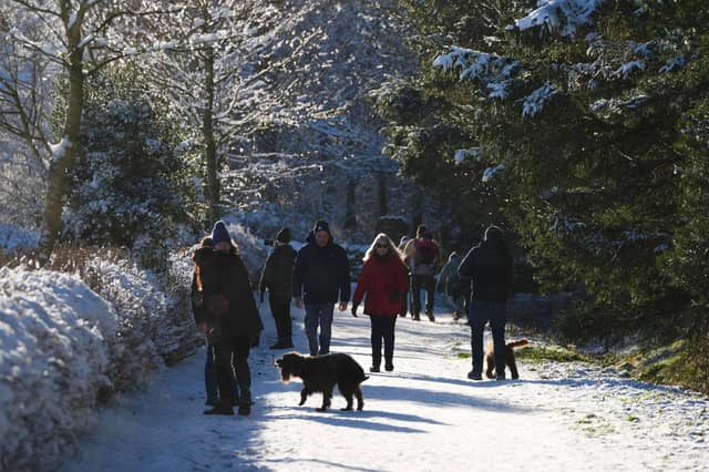 People take a walk through the snow in the Pentland Hills, Balerno.