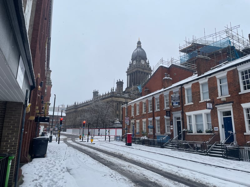 The town hall loomed over a frosted scene in the heart of the city.
