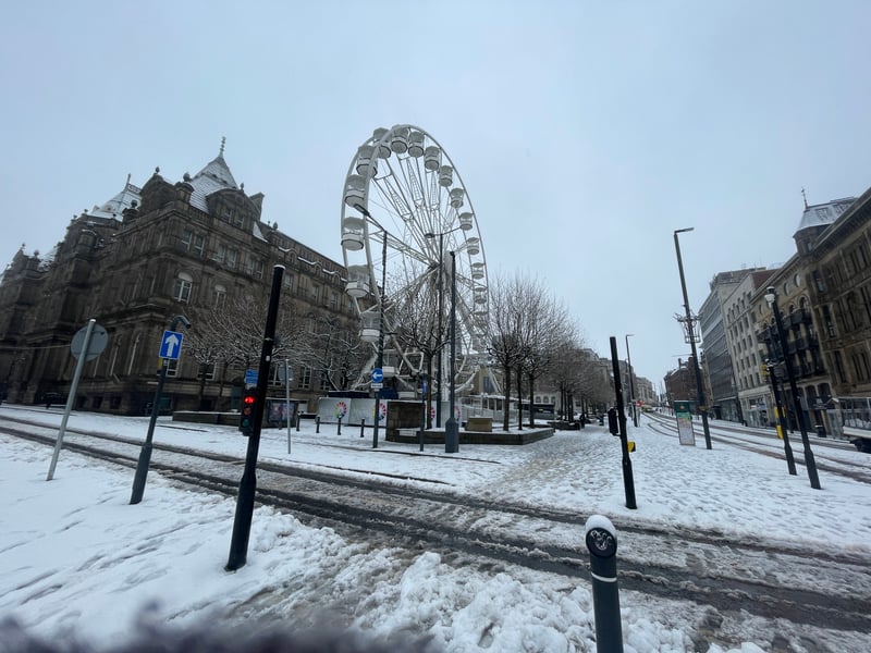 There were several people out for a snowy stroll along the Headrow this morning.