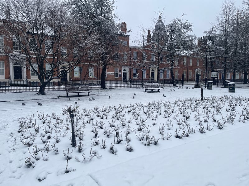 Empty benches in Park Square, as the garden was completely covered with snow.