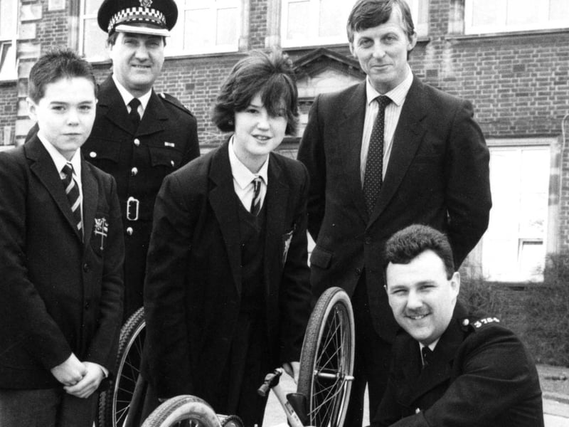 Schools Liaison Officer Mike Cornwas  stamping Sarah Jamieson and Wayne Sinclair's bikes, in a 1990 scene from Harton Comprehensive School.