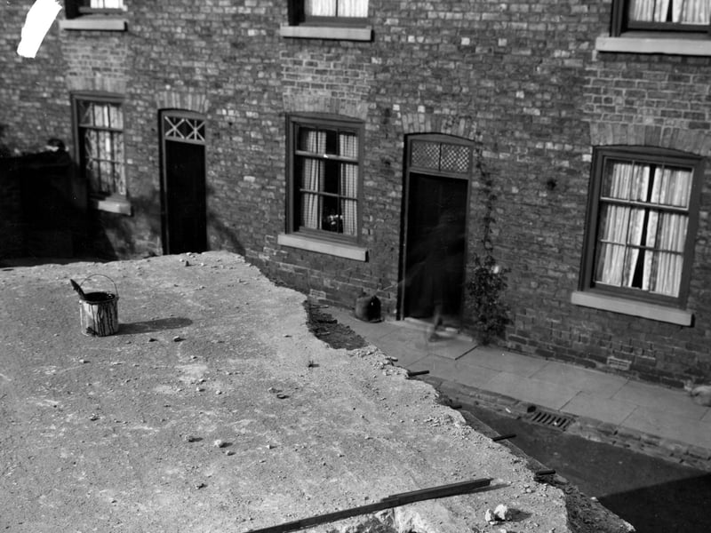 The damaged roof of outside toilets in Backhouse Yard pictured in August 1942.