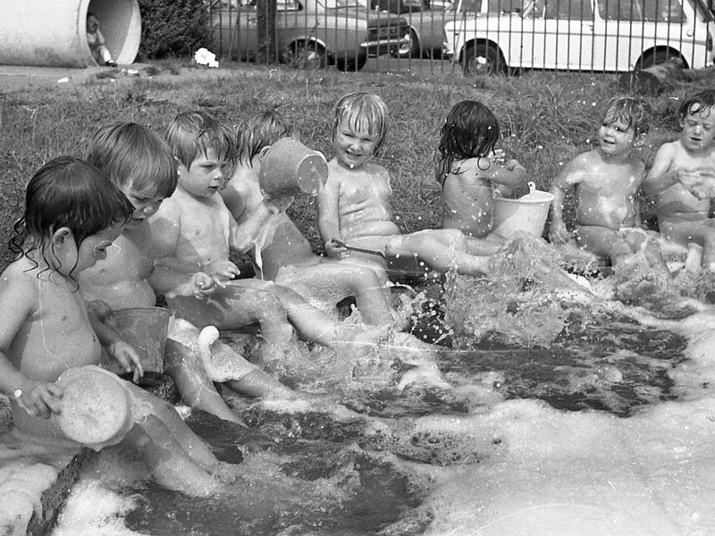 Bath time was never like this... and what a sneaky way these grown-ups have of keeping us clean! Children of the Hartington Road Day Nursery, Preston, don't know anything about centigrade and fahrenheit but they reckon that clothes are just a waste of time when the sun is beating down and there's a paddling pool outside. But never mind the heatwave...