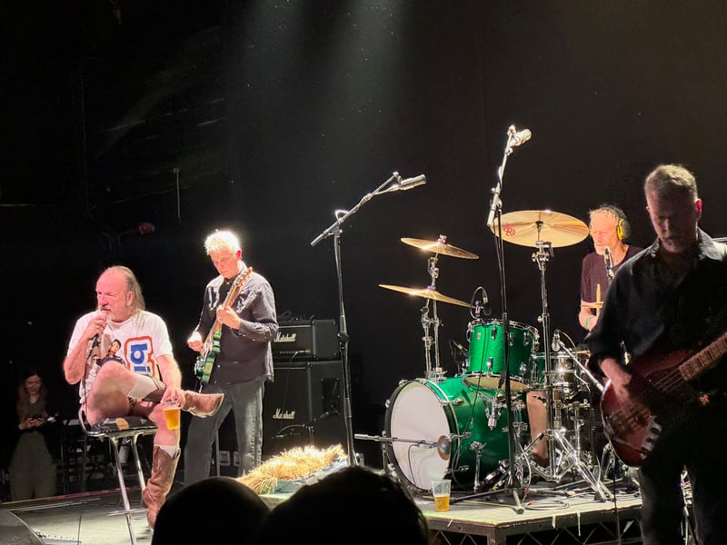 Yow takes a breather - before throwing his chair into the audience.