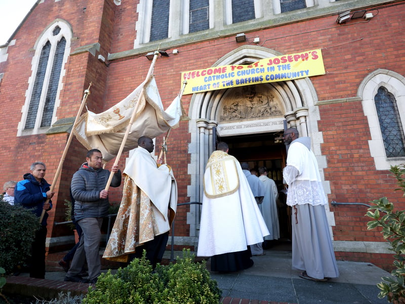 The procession returning to the church for Benediction and then Mass