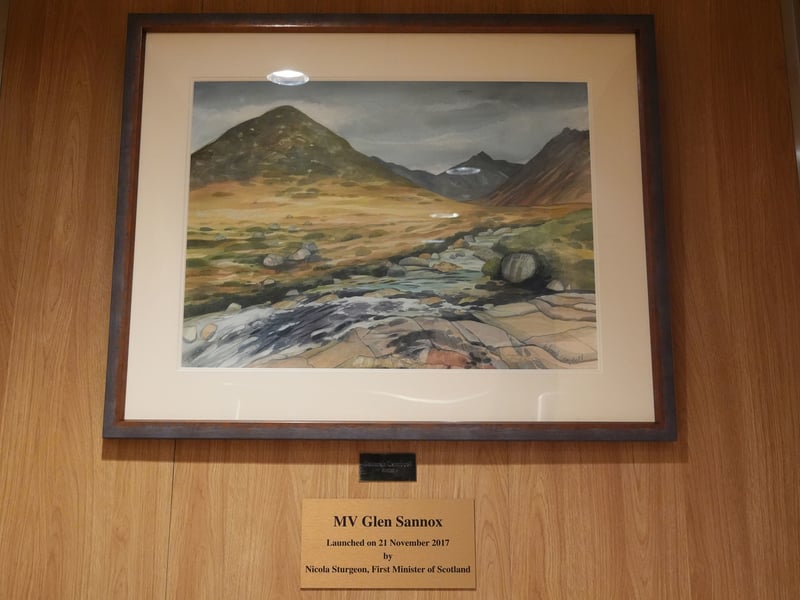 A plaque and painting onboard the Glen Sannox ferry as it journeys from Troon to Brodick on Isle of Arran on its first official day in service.