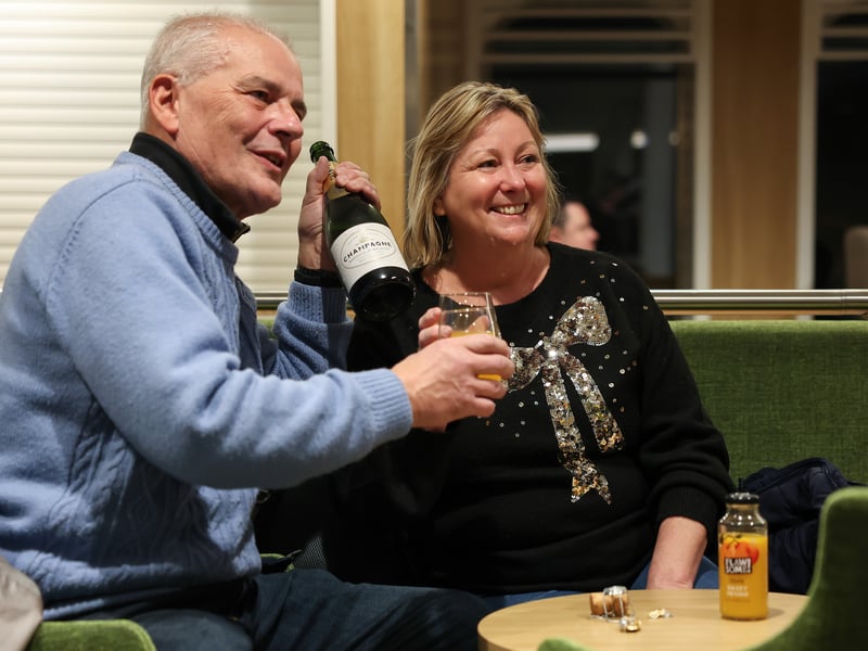 Passengers enjoy a glass of bubbles onboard the Glen Sannox for its first official passenger sailing from Troon. The MV Glen Sannox ferry commenced regular passenger sailings from Troon in Ayrshire to Brodick on the Isle of Arran on Monday, following budget woes and years of delays