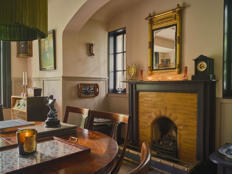 Dining room with its original restored fireplace with ochre tiles