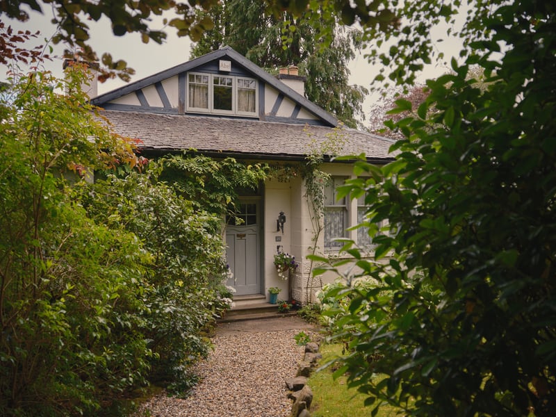 Exterior of the house with pea gravel drive