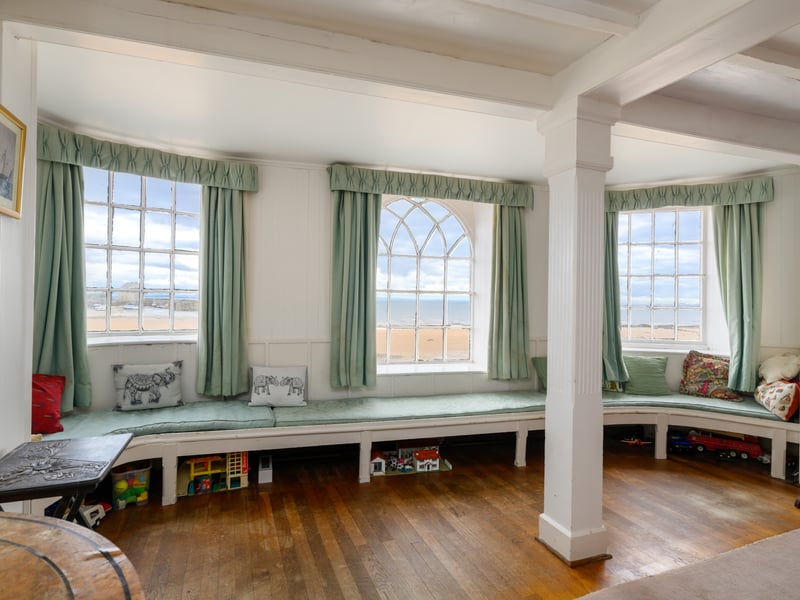 The elegant window seat in the sitting room at the front of the house is a nice place to enjoy views of the beach