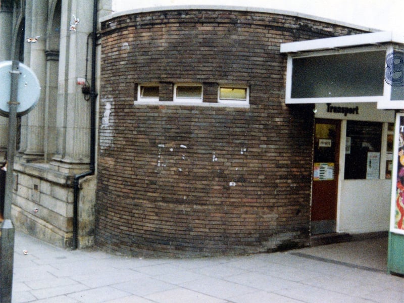 The West Yorkshire Passenger Transport Executive's Transport Information Office on the corner of Kirkgate and New Market Street, a round brick building infront of the Trustee Savings Bank. Pictured in December 1979.