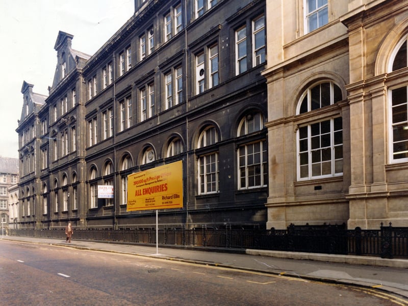 The side of the General Post Office building from Quebec Street. It fronts on to City Square, off to the right, and was designed in a Renaissance style by the Board of Work's architect Henry Tanner. It was built at a cost of £75,000 and opened in 1896. This ohoto from April 1979 has a sign saying 'All Enquiries' superimposed on the image by the planning departmaent.