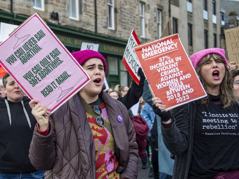 Some protesters highlighted a rise in violent crime against women