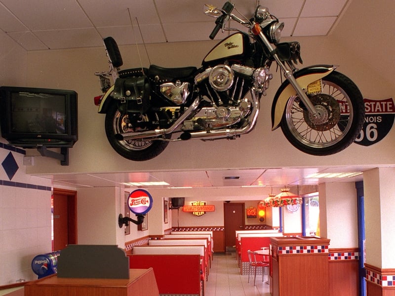 The Harley Davidson hanging from the ceiling at the KFC restaurant on Stanningley Road. Pictured in July 1998.