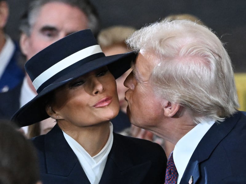 President Donald Trump kisses wife Melania as he arrives for the inauguration ceremony.