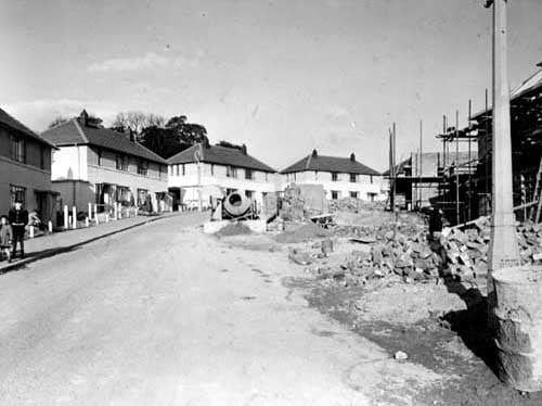 The construction of Brooklands Lane on the Seacroft Estate. On the left, the semi-detached houses are complete. Pictured in October 1951.