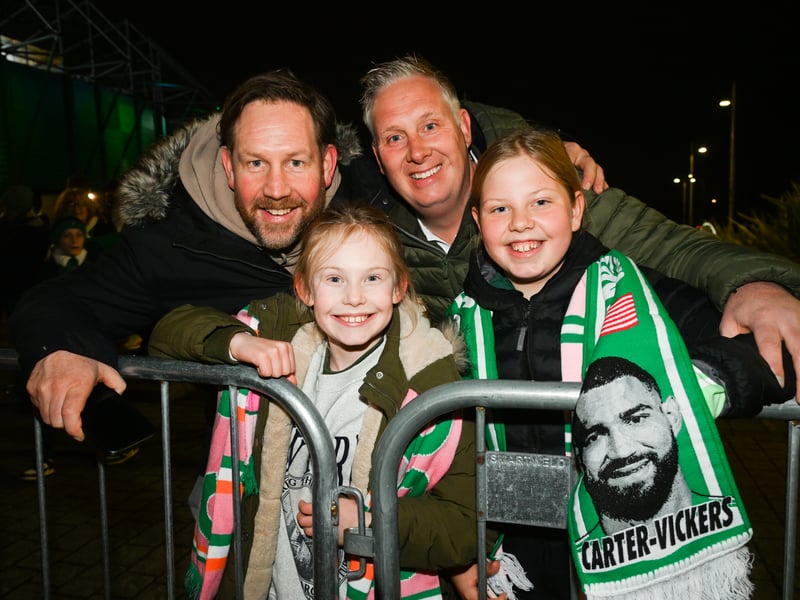 Four Celtic fans pose for a photo ahead of the game at Celtic Park.