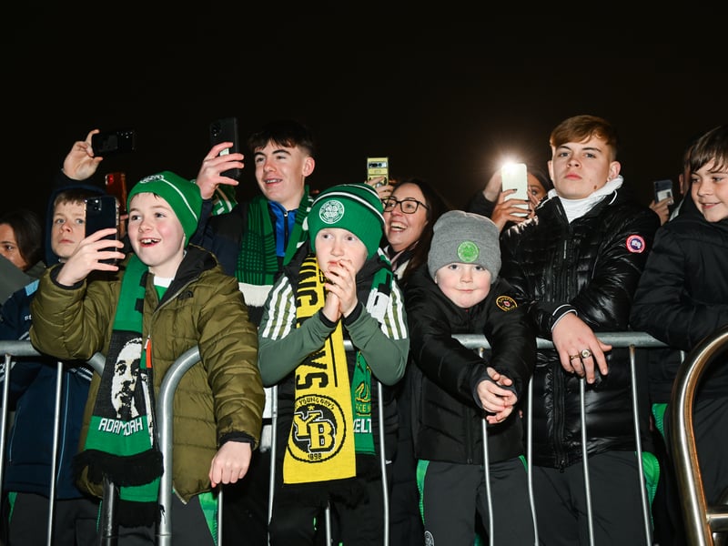 Celtic fans welcome the team ahead of the game at Celtic Park.