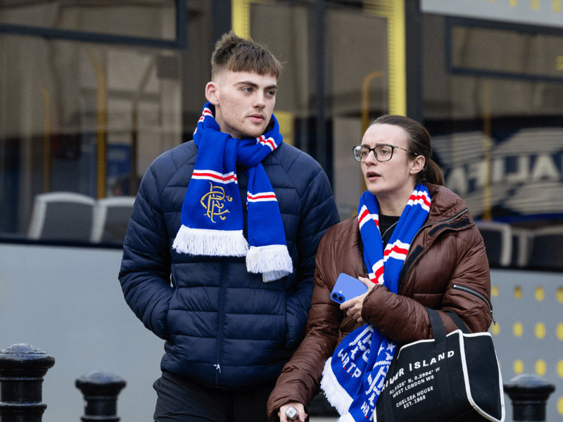 Two Rangers fans prepare to get the tram to Old Trafford the big game.