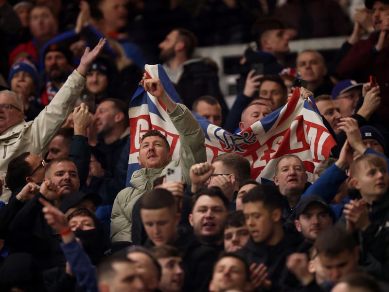 Rangers supporters cheer the team on.