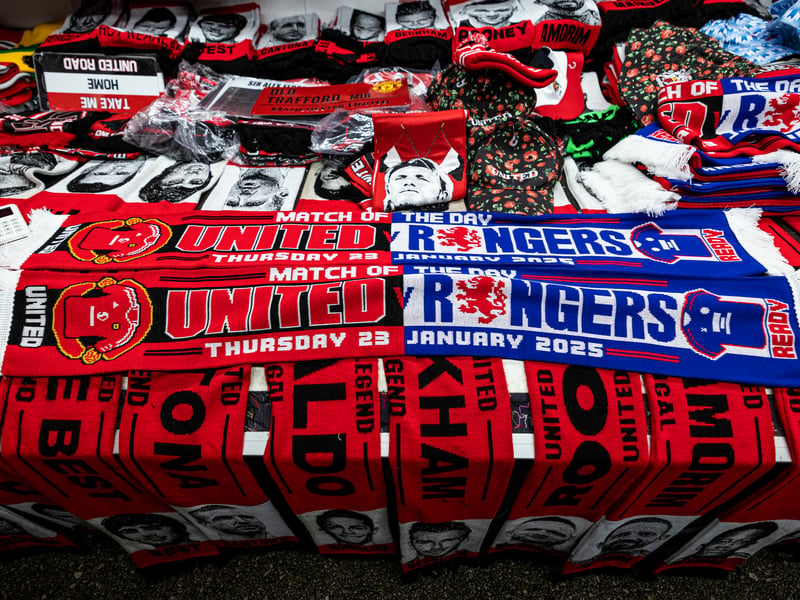 Commemorative scarves are sold outside of Old Trafford.
