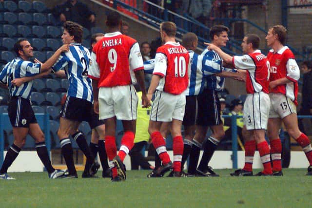 Paolo Di Canio (far left) who reacted to a red card by pushing referee Paul Alcock