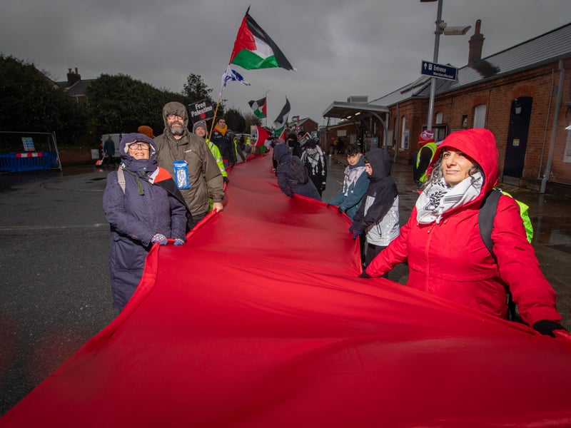 Over a hundred of pro-Palestine protesters marched from Fratton to Portsmouth City Centre with half-a-kilometre-long piece of red fabric as part of The Red Line march for Palestine
