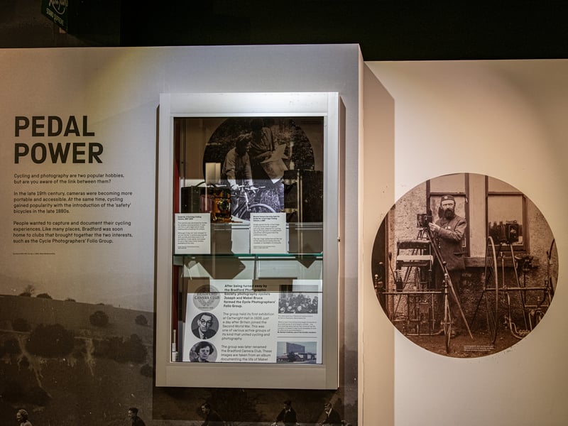 The gallery delves into Kodak’s pivotal role in the development of consumer photography, starting with George Eastman’s invention of flexible film and the launch of the first affordable camera, the Kodak Brownie, which made photography accessible to the general public.