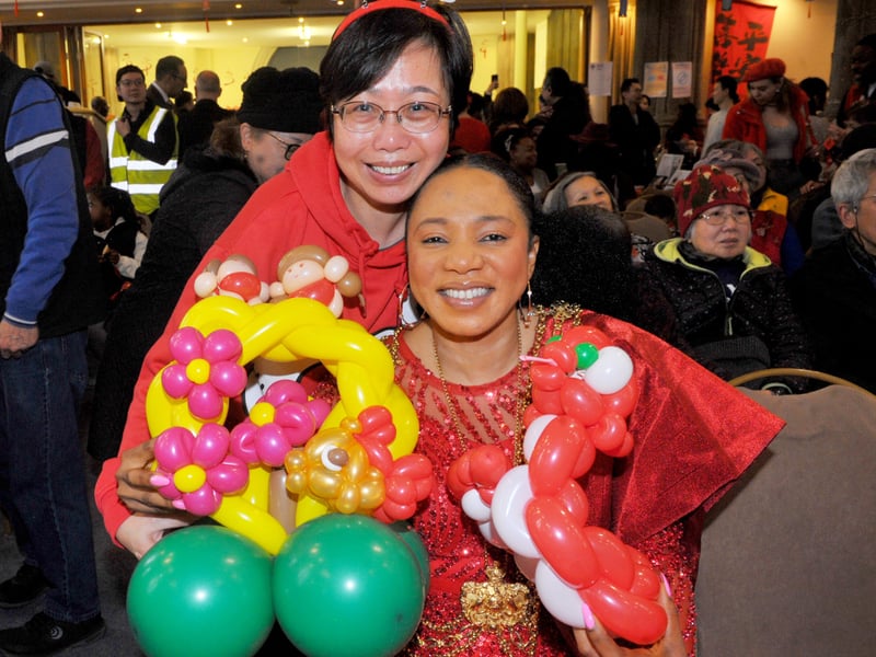 Esabella Wong who made the New Year snake balloons with The Lord Mayor of Leeds Coun Abigail Marshall-Katung.