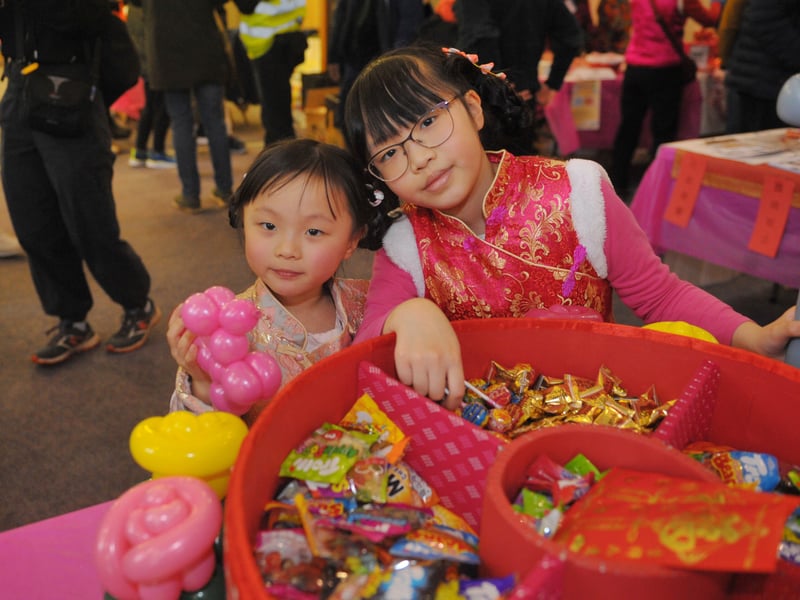 Sisters Tiffany and Charlotte Chen select a sweet.