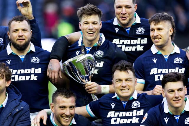 Scotland's Huw Jones with the The Cuttitta Cup after scoring a hat-trick in the Six Nations win over Italy at Murrayfield. (Photo by Ross MacDonald / SNS Group)
