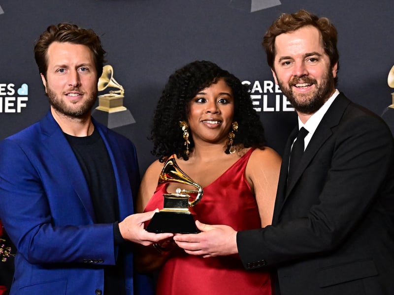 US director Matthew Heineman, Lauren Domino and Joedan Okun pose in the press room with the Grammy for Best Music Film for "American Symphony Jon Batiste" during the 67th Annual Grammy Awards.