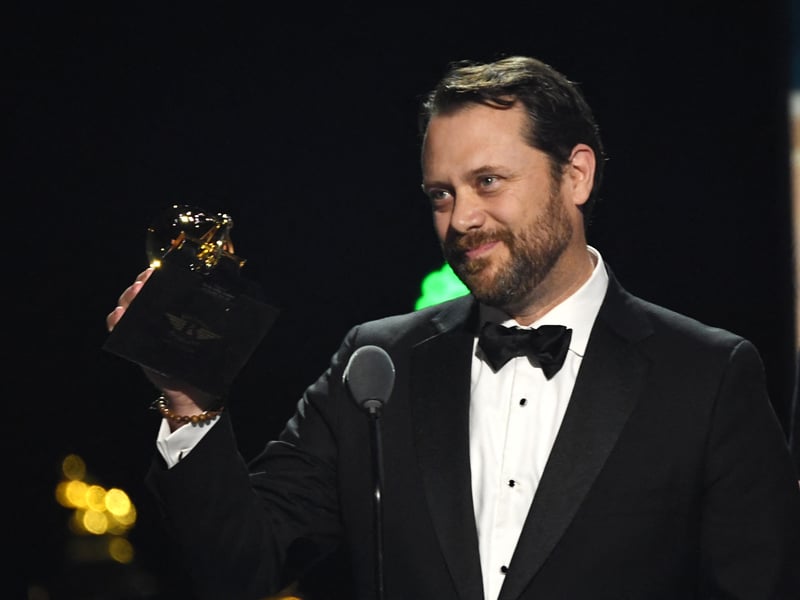 Jason Carter, son of late US President Jimmy Carter, accepts the award for best audiobook, narration, and storytelling recording for "Last Sundays in Plains: A Centennial Celebration" on stage during the 67th Annual Grammy Awards.