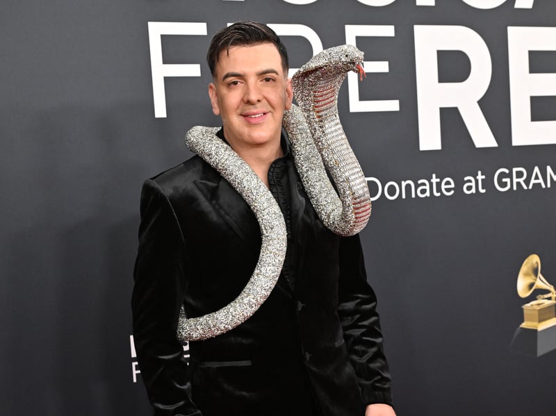 Musician Markos D1 ruined a perfectly nice black suit by having a tacky crystal snake attached to his shoulder all night. (Photo by Robyn Beck / AFP) / RESTRICTED TO EDITORIAL USE (Photo by ROBYN BECK/AFP via Getty Images)      