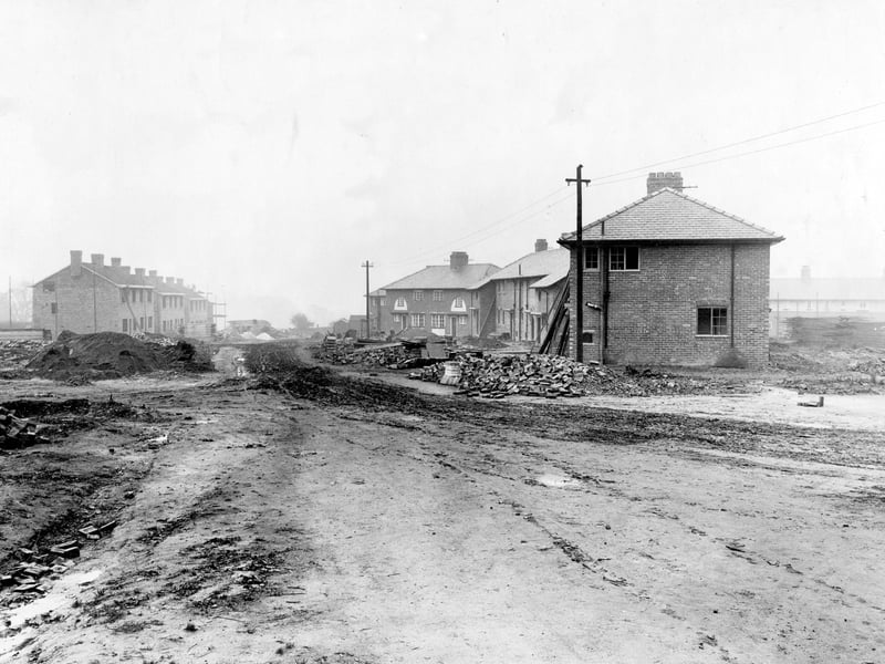 This photo from September 1920 shows the building developments on the Wyther Housing Estate. Piles of rubble, mud, bricks and debris can be seen throughout the photo. Telegraph poles can also be seen.