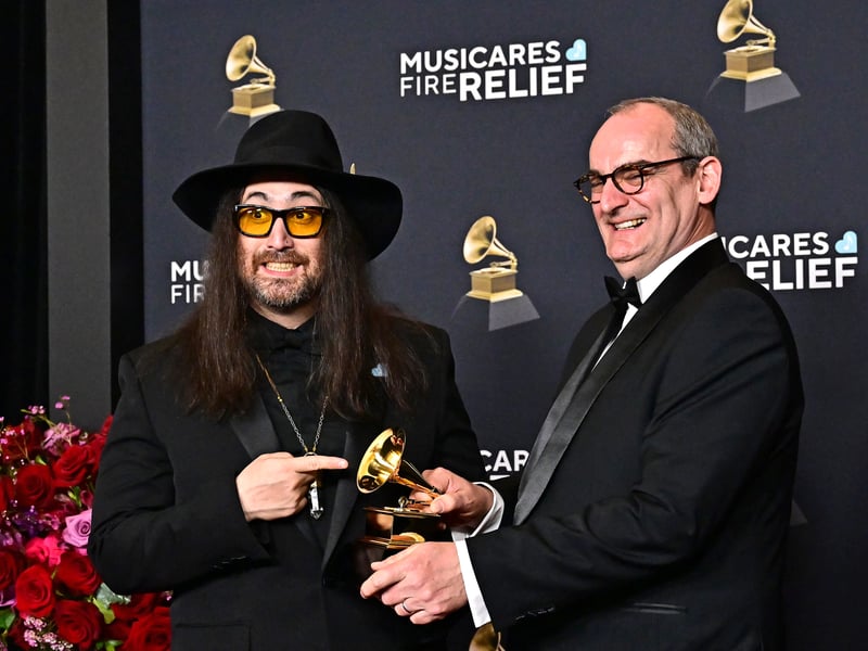 US musician Sean Lennon, left, and filmmaker Simon Hilton pose in the press room with Best Rock Performance award on behalf of The Beatles for "Now and Then" during the 67th Annual Grammy Award.