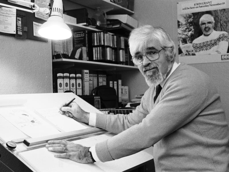Edinburgh-born author John Grant, creator of the Littlenose books, at work on his drawing board in November 1985.