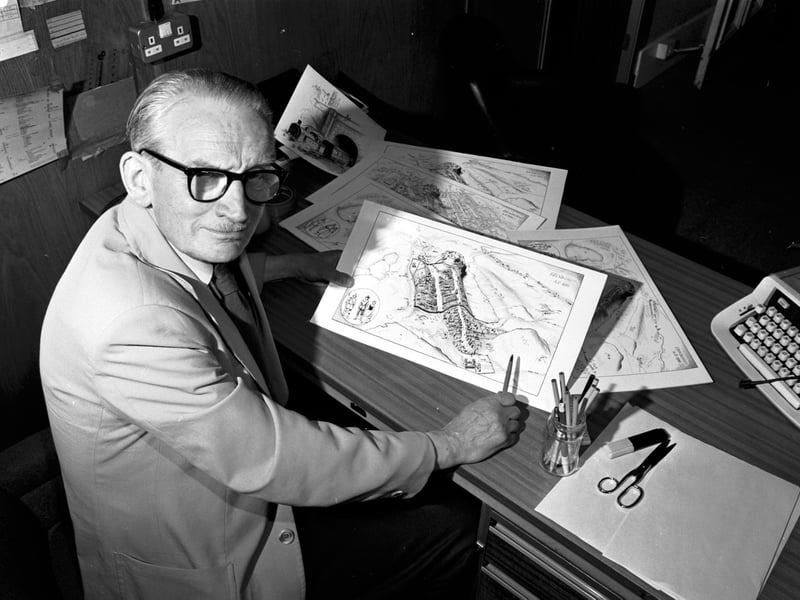 Scottish illustrator ('Scottish Surnames'), artist, cartographer and photographer John Mackay with some samples of his work in June 1986.