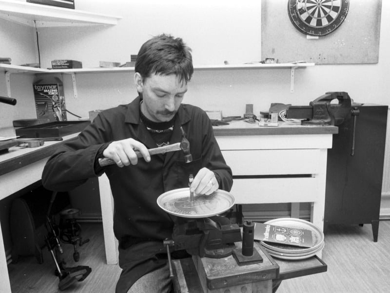 Peter Meldrum stamps a hallmark onto a silver dish at the Edinburgh Assay Office in October 1986.