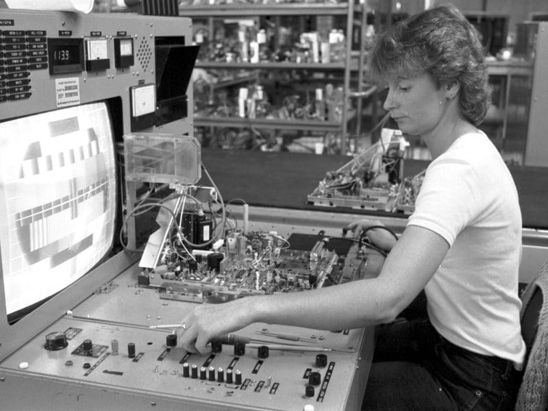 A woman tests and adjusts the colour alignment on television sets at Mitsubishi electronics factory in Haddington, May 1984.