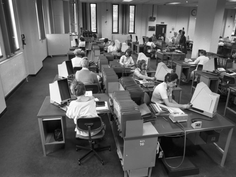 The Directory Enquiries department at British Telecom's Fountainbridge offices in Edinburgh, July 1985. Long before fully-automated searching, operators used microfiche to find telephone numbers.