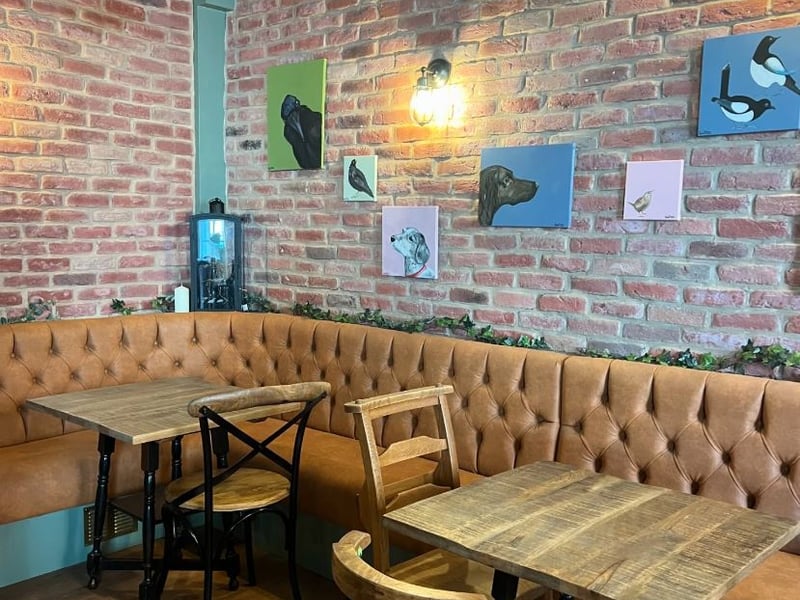 The pub is leaning into a nature angle, being situated near a park. Gaze around the pub and photos show flying birds and pensive-looking dogs