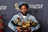 Kendrick Lamar poses with the Record Of The Year, Best Rap Performance, Song Of The Year, Best Music Video, Best Rap Song awards in the press room during the 67th Annual Grammy Awards.     